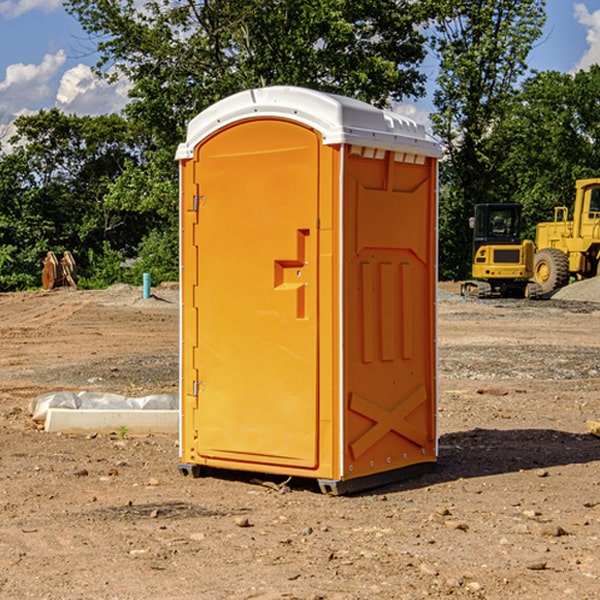 what is the cost difference between standard and deluxe portable restroom rentals in Dryville